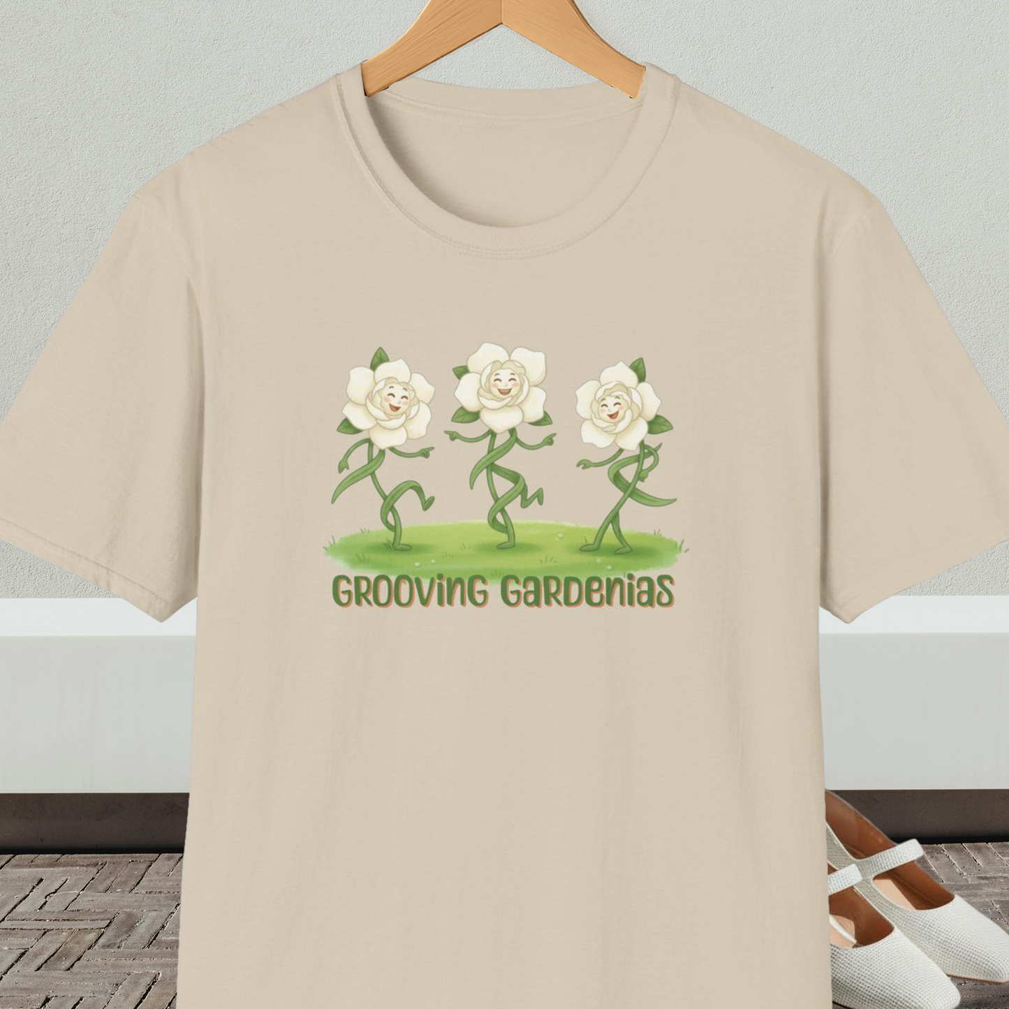 Beige t-shirt with 'Grooving Gardenias' cartoon graphic and text