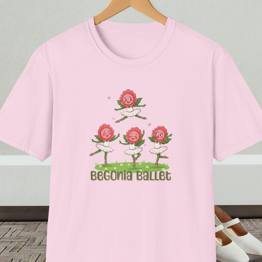 Light pink t-shirt with 'Begonia Ballet' design, on a hanger against a white wall.