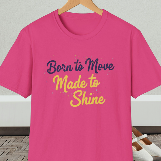 Bright pink t-shirt with 'Born to Move, Made to Shine' text, on a hanger against a white wall.