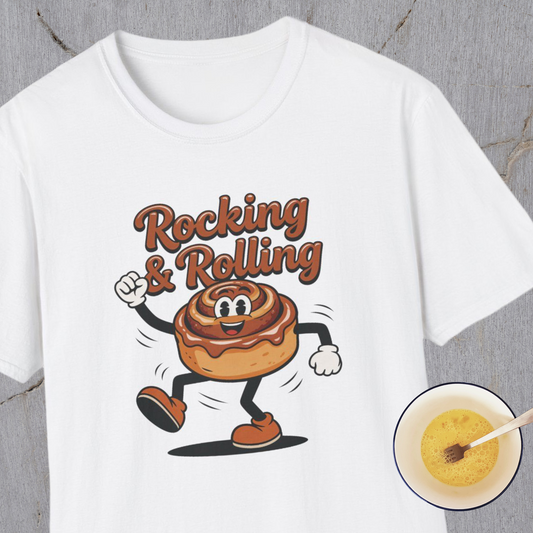 White t-shirt with a cartoon cinnamon roll character and text 'Rocking & Rolling' on a gray background.