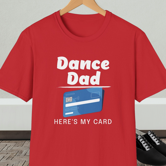 Red t-shirt with 'Dance Dad, Here's My Card' text and credit card graphic, on a hanger with a neutral background.