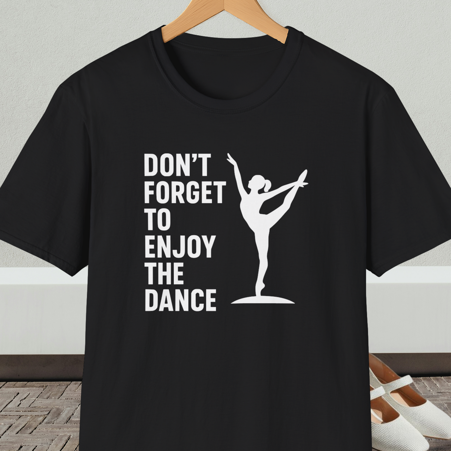 Black t-shirt with a white silhouette of a dancer and text 'Don't Forget to Enjoy the Dance'