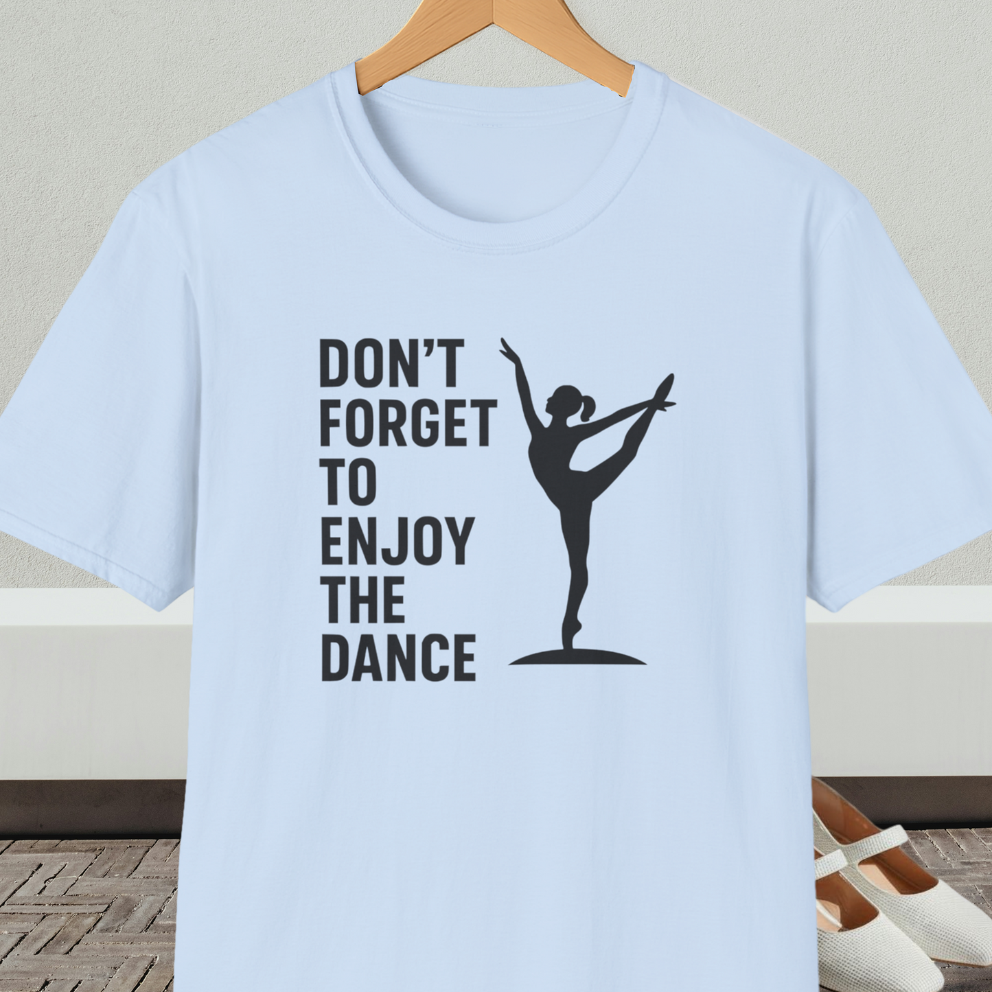 Light blue t-shirt with a black silhouette of a dancer and text 'Don't Forget to Enjoy the Dance'