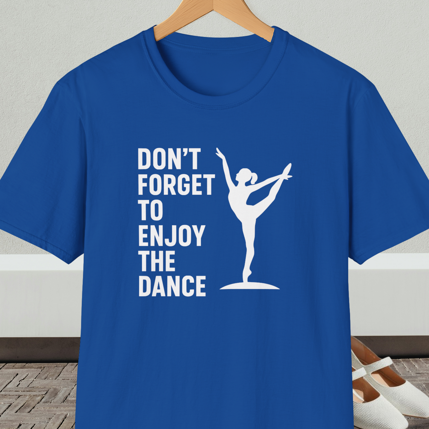 Royal blue t-shirt with a white silhouette of a dancer and text 'Don't Forget to Enjoy the Dance'