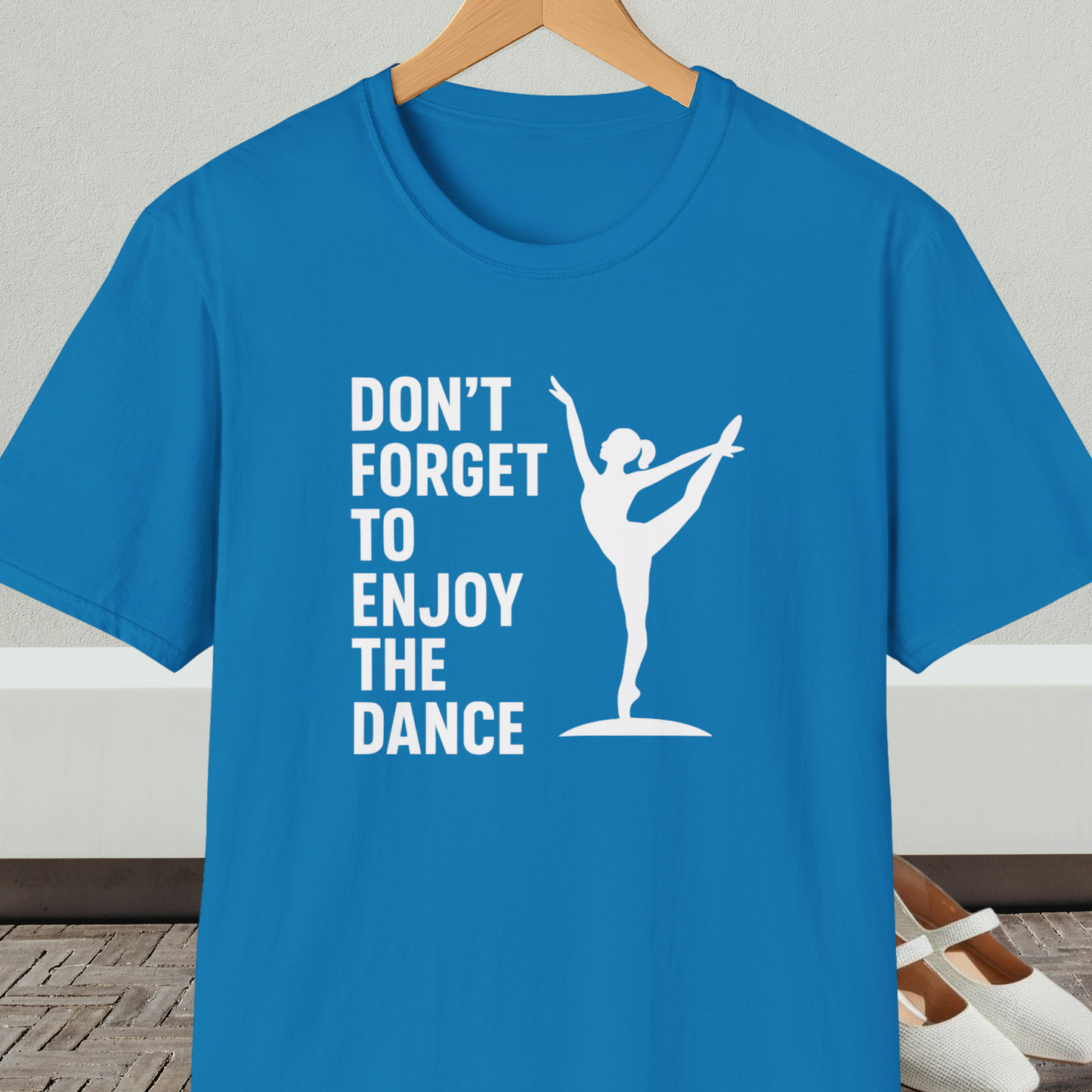 Sapphire blue t-shirt with a white silhouette of a dancer and text 'Don't Forget to Enjoy the Dance'