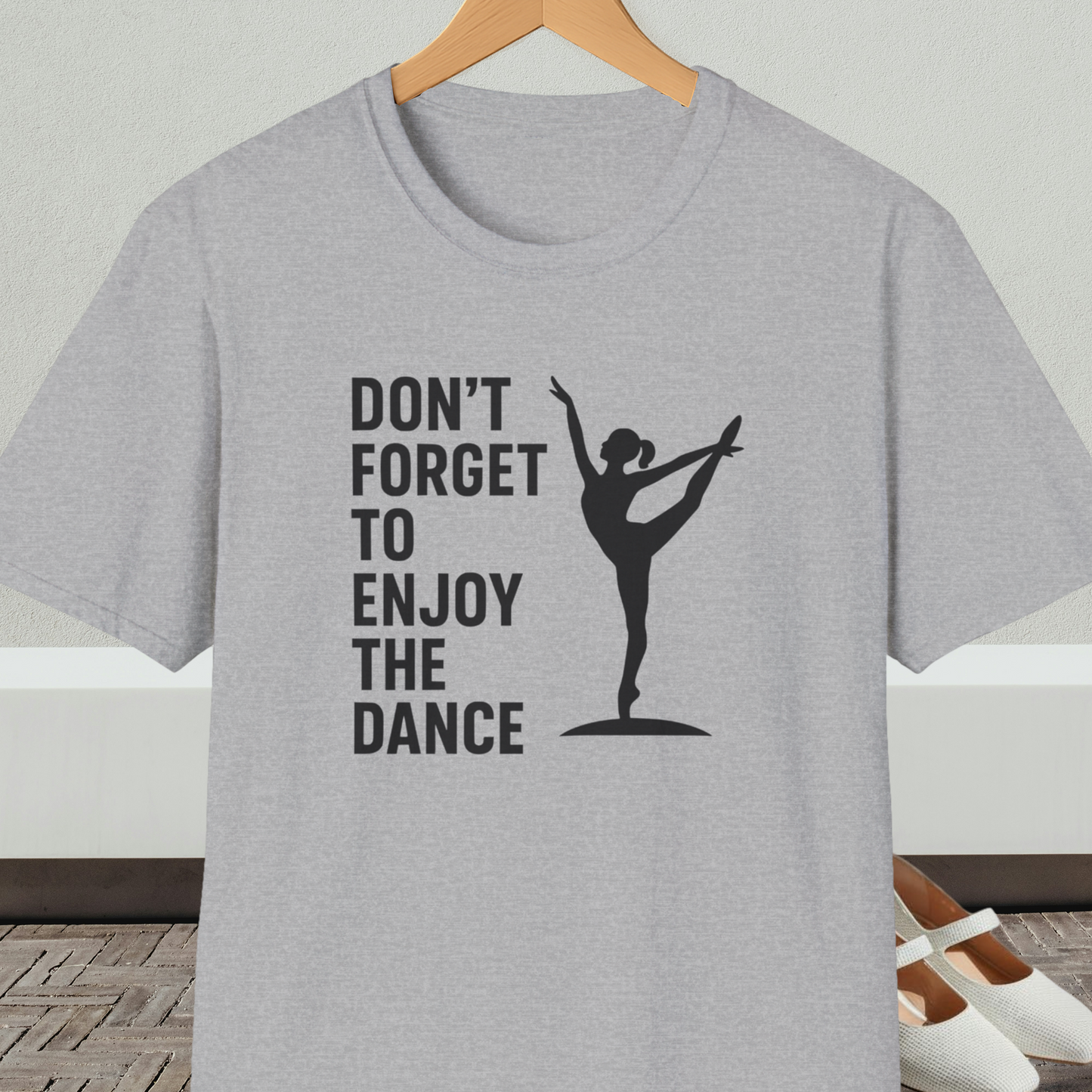 Gray t-shirt with a black silhouette of a dancer and text 'Don't Forget to Enjoy the Dance'