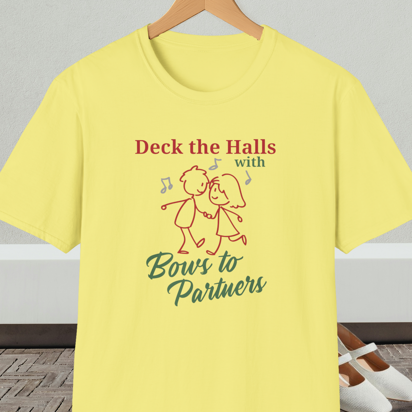 Yellow tee shirt with a square dance couple and the words 'Deck the Halls with Bows to Partners'