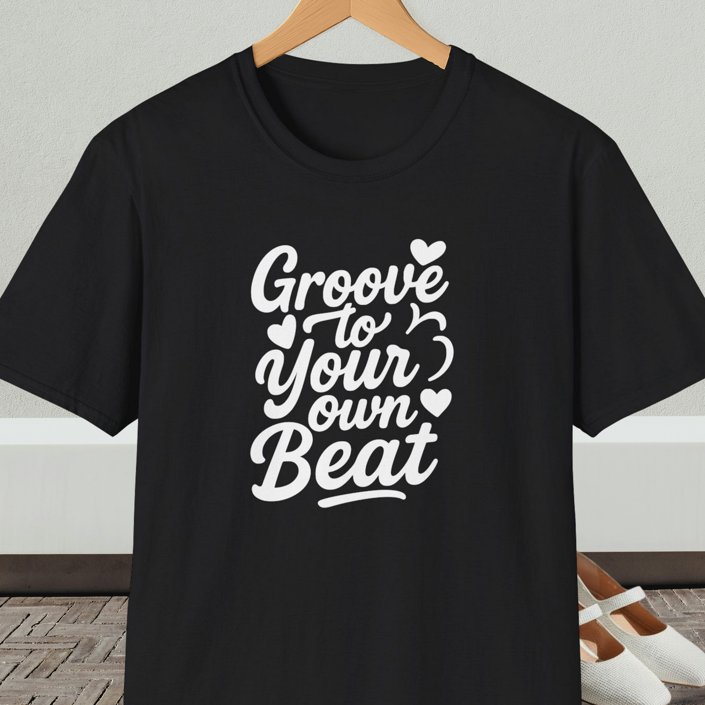 Black tee shirt with 'Groove to Your Own Beat' text in white script