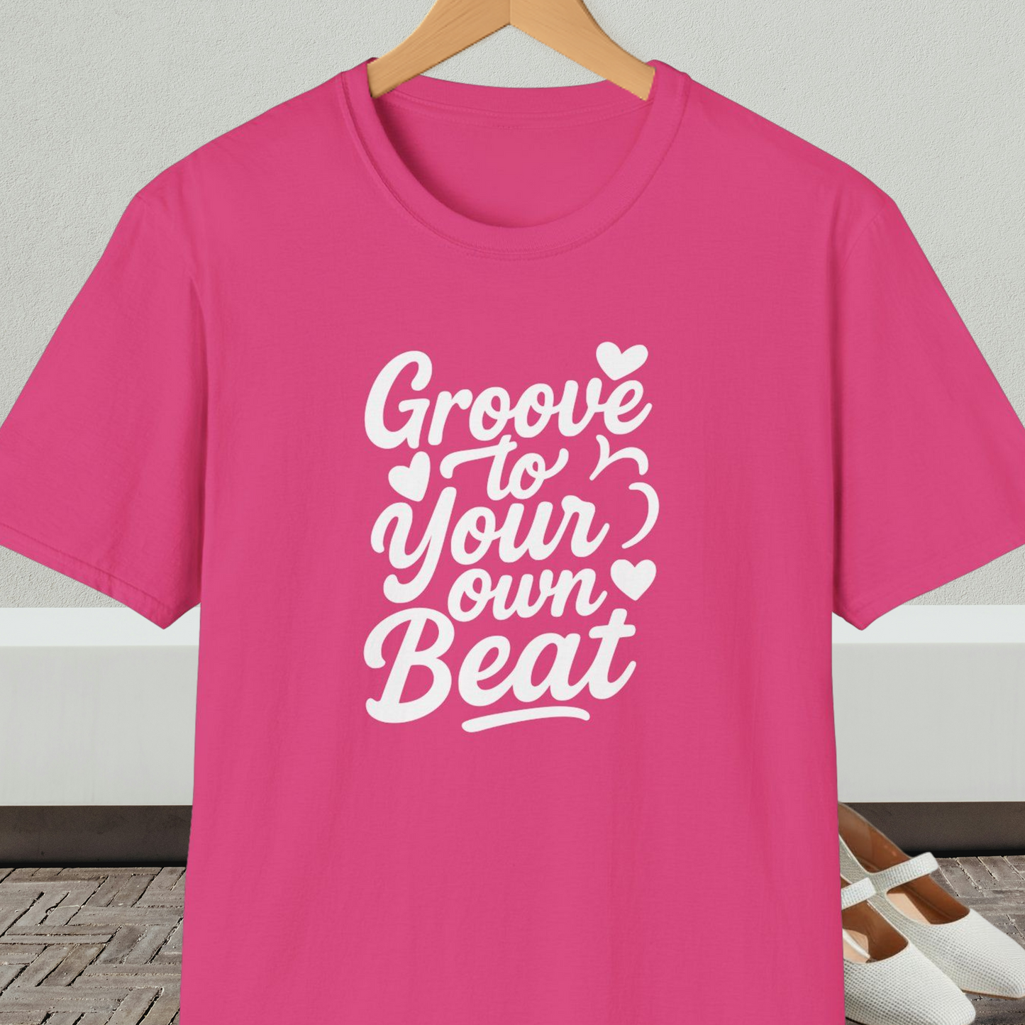 Bright pink tee shirt with 'Groove to Your Own Beat' text in white script