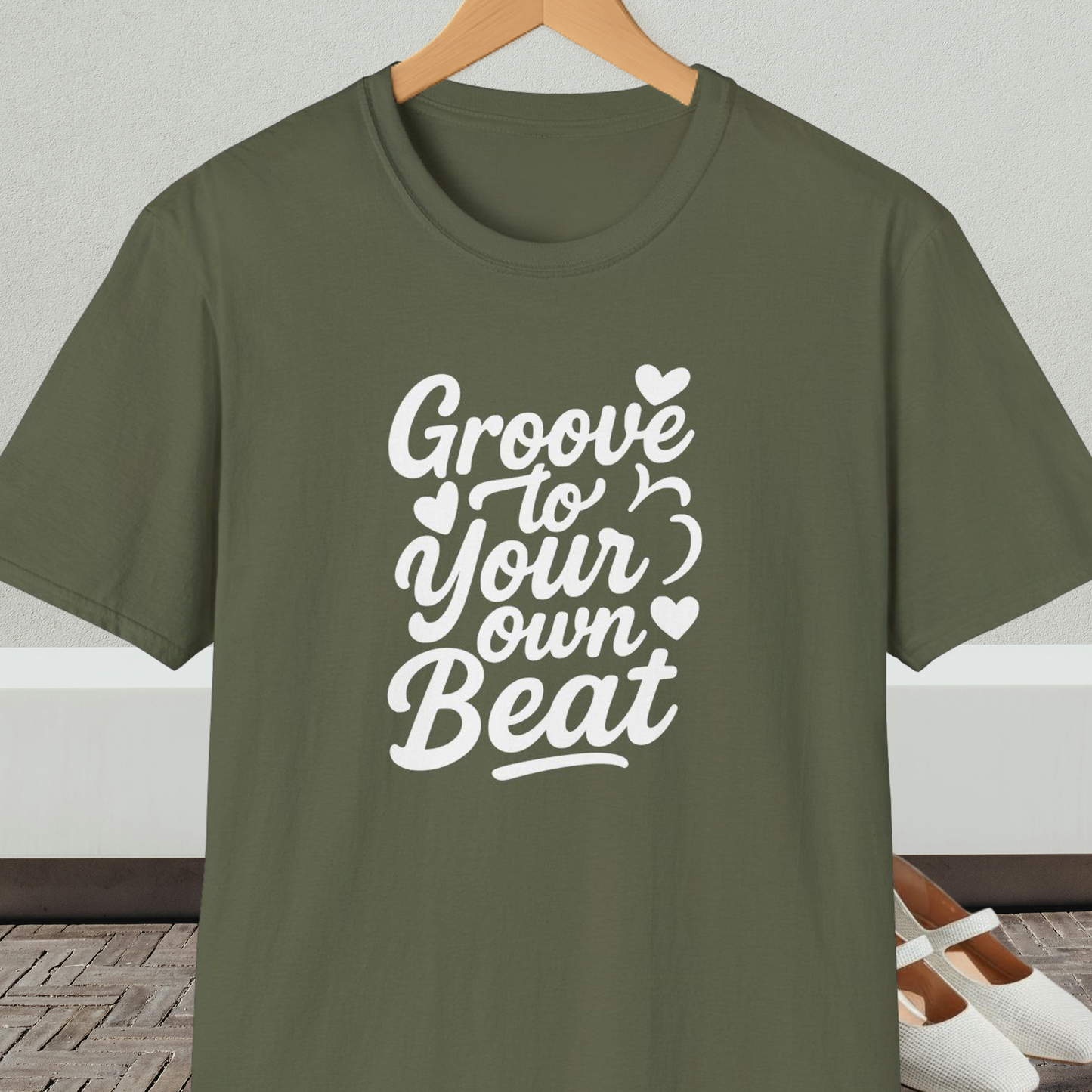 Military green tee shirt with 'Groove to Your Own Beat' text in white script