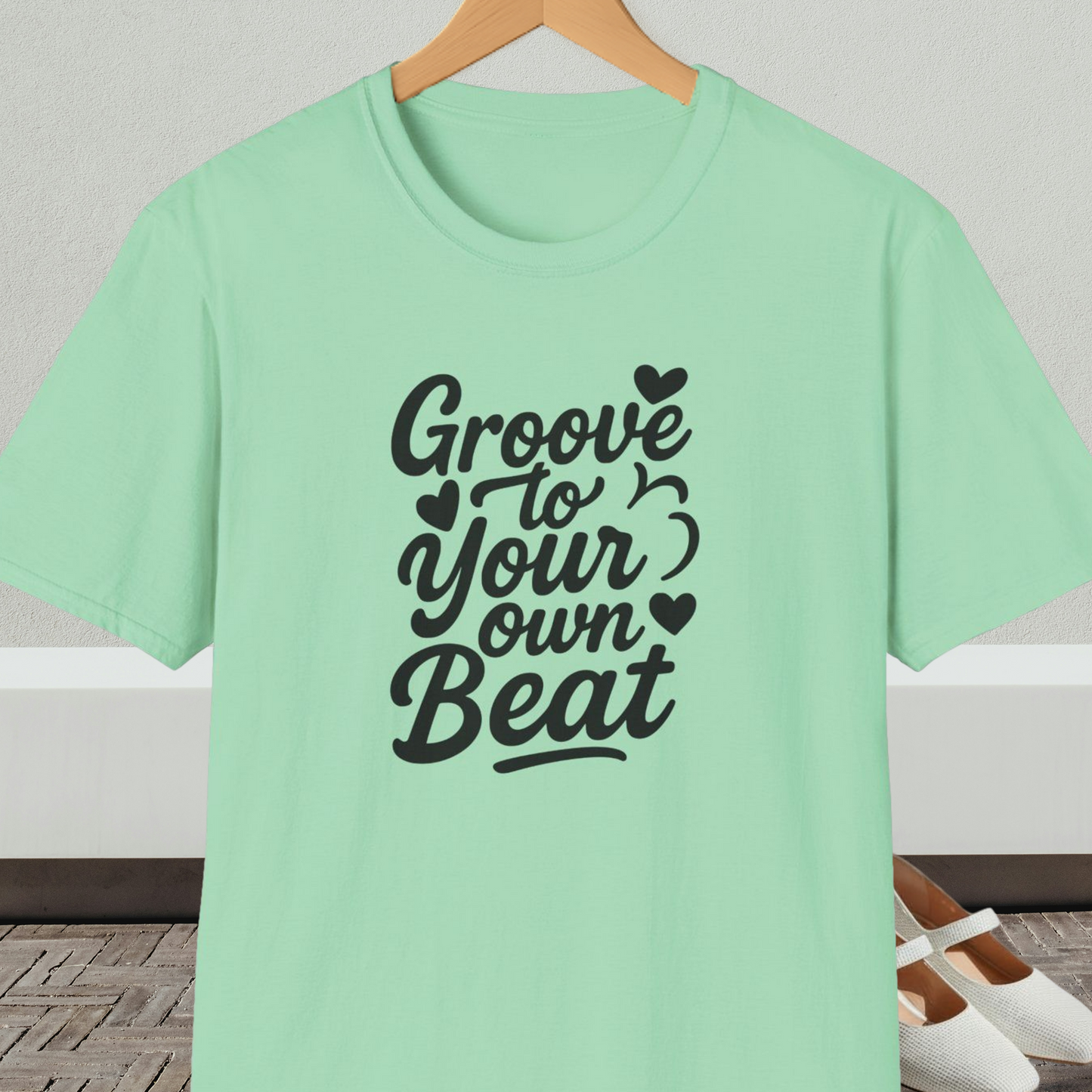 Mint green tee shirt with 'Groove to Your own Beat' in black script letters