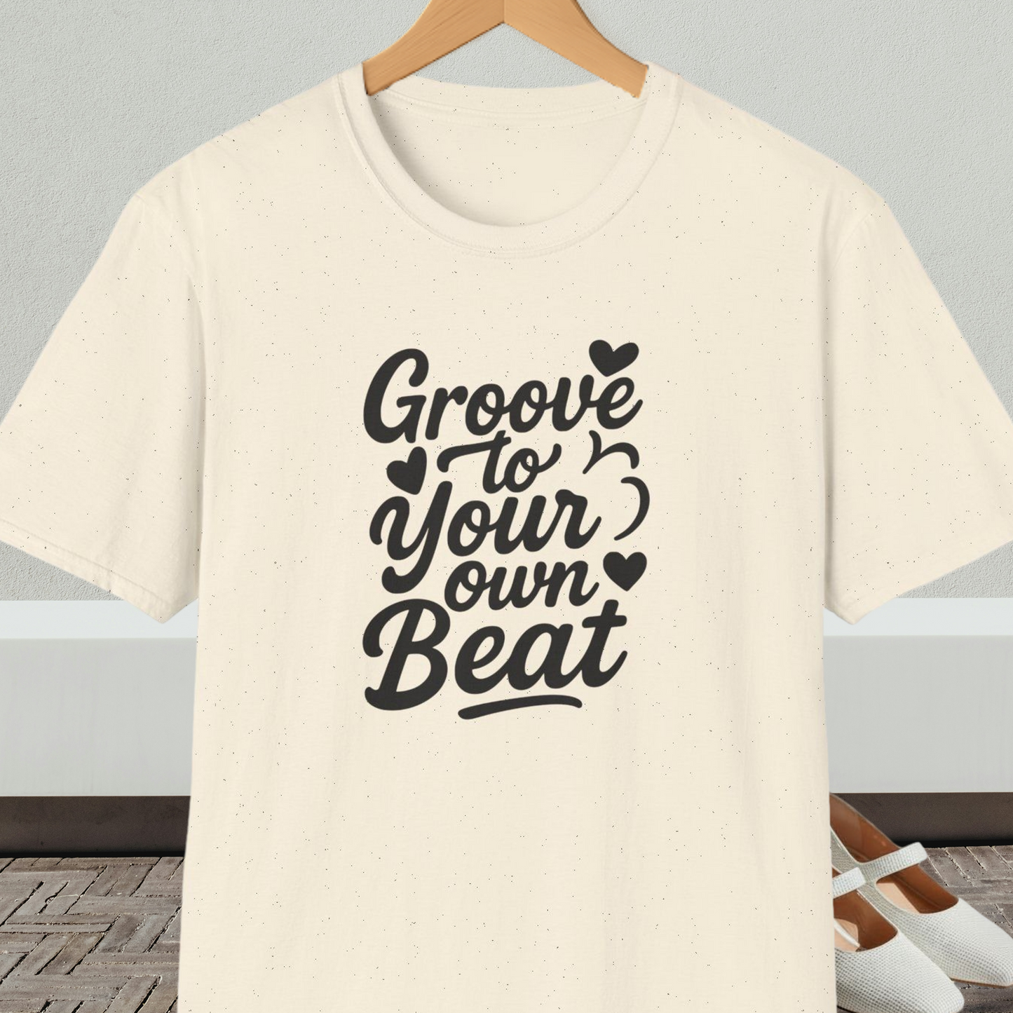 Natural beige tee shirt with 'Groove to Your own Beat' in black script letters