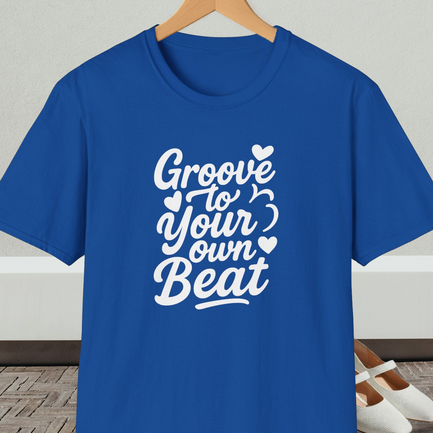 Royal blue tee shirt with 'Groove to Your Own Beat' text in white script