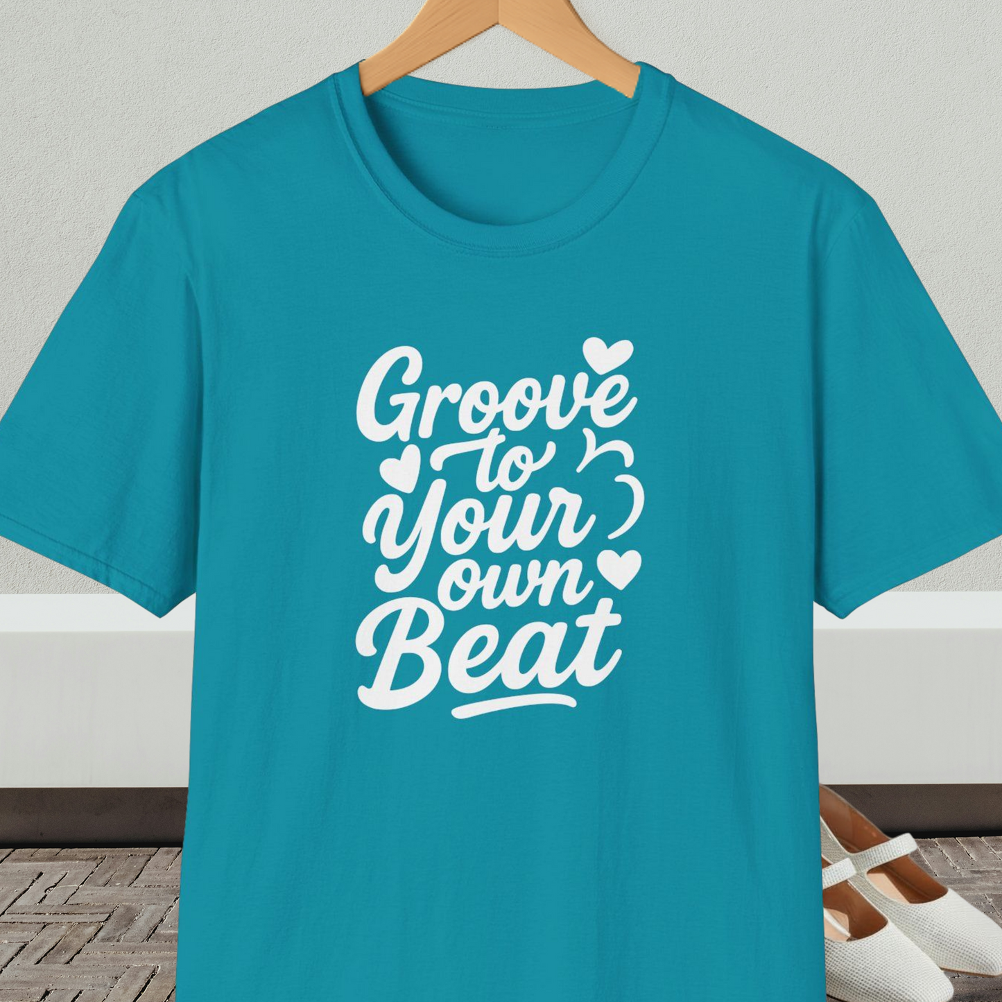 Turquoise tee shirt with 'Groove to Your Own Beat' text in white script