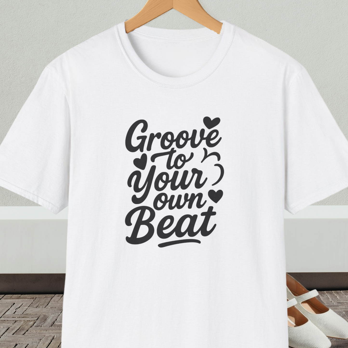 White tee shirt with 'Groove to Your own Beat' in black script letters
