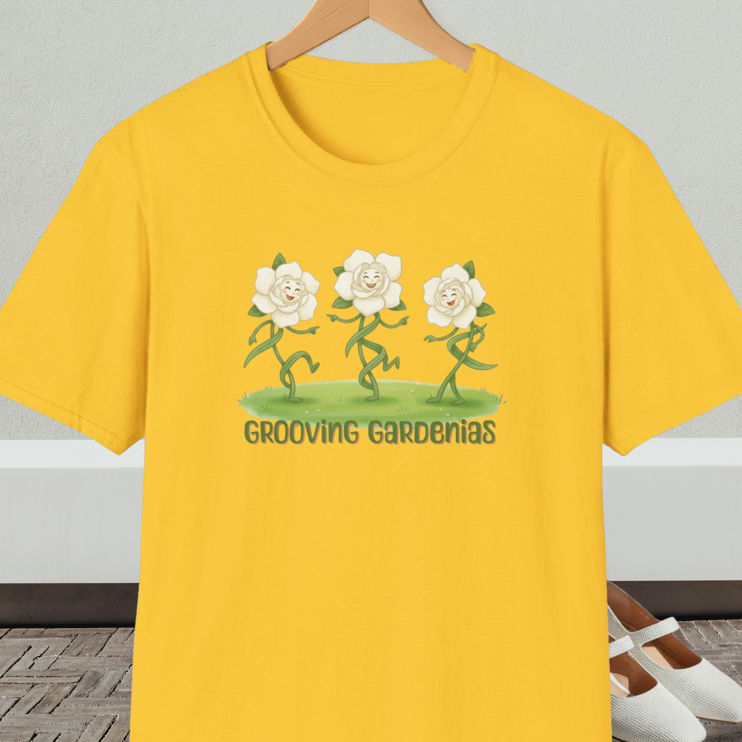 Yellow t-shirt with 'Grooving Gardenias' cartoon graphic and text