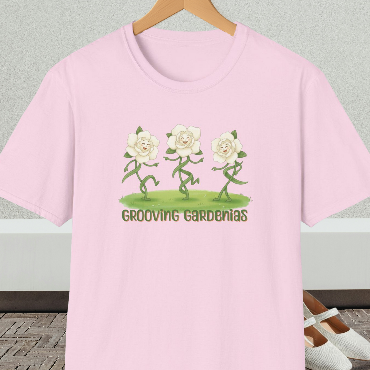 Pink t-shirt with 'Grooving Gardenias' cartoon graphic and text