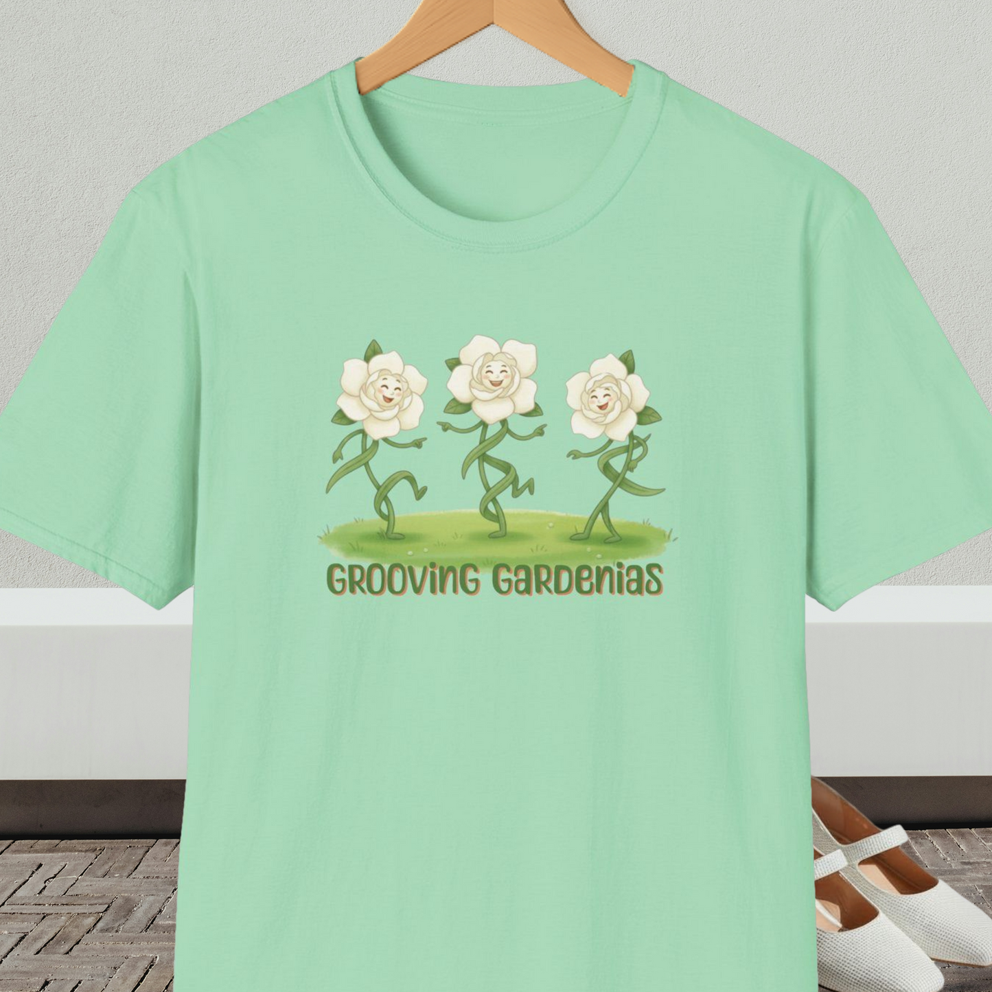 Mint green t-shirt with 'Grooving Gardenias' cartoon graphic and text