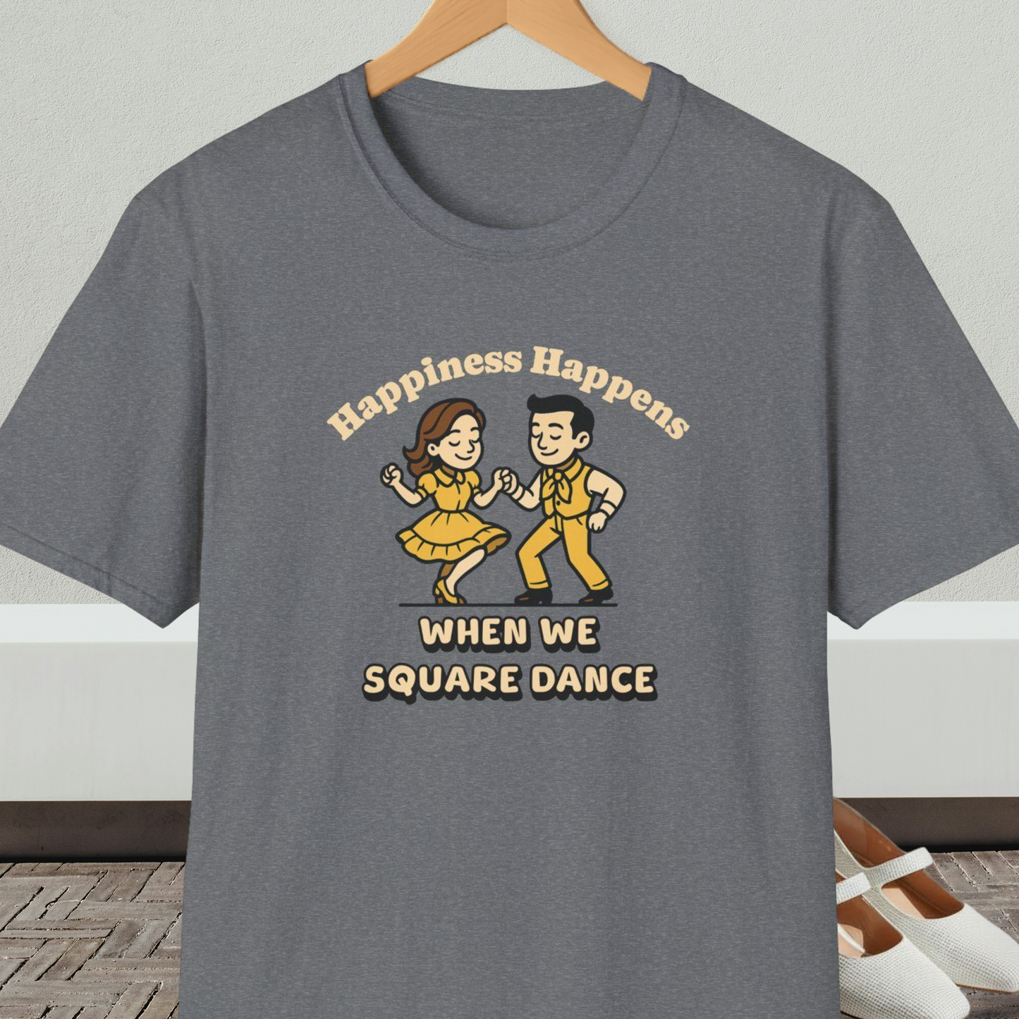 Gray t-shirt with a graphic of two people square dancing and text 'Happiness Happens When We Square Dance'
