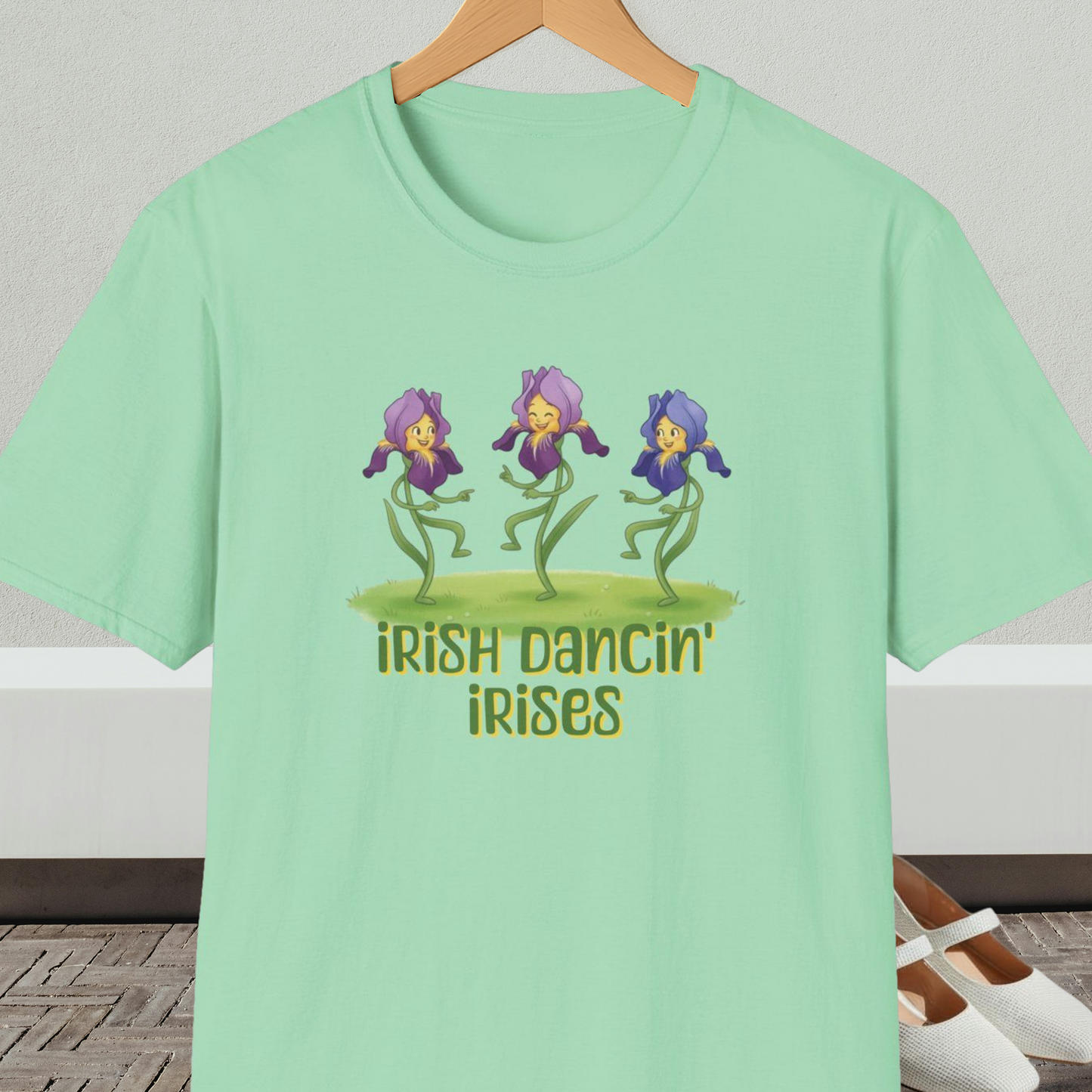 Mint green t-shirt with 'Irish Dancin Irises' text and cartoon dancing flowers design.