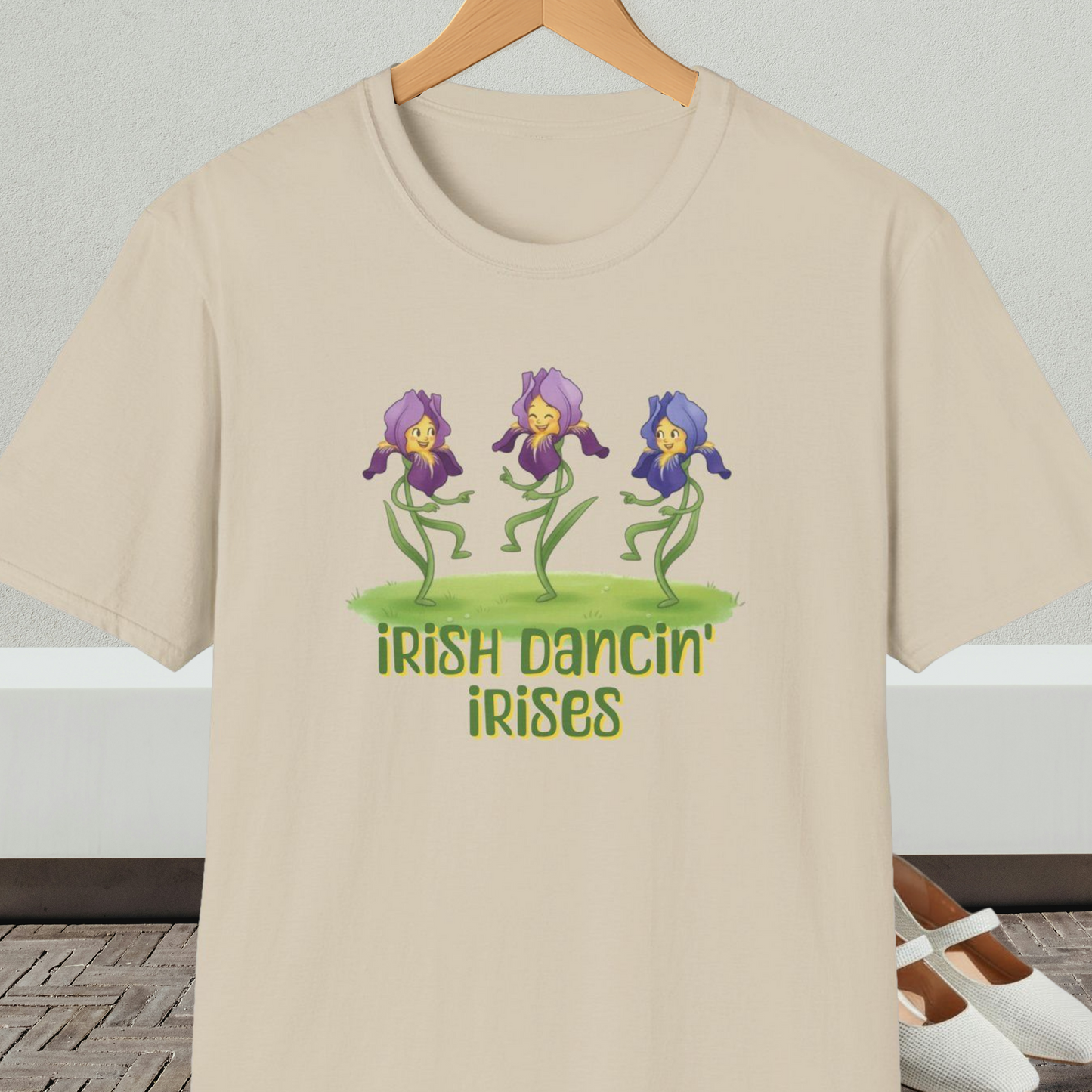 Beige t-shirt with 'Irish Dancin Irises' text and cartoon dancing flowers design.