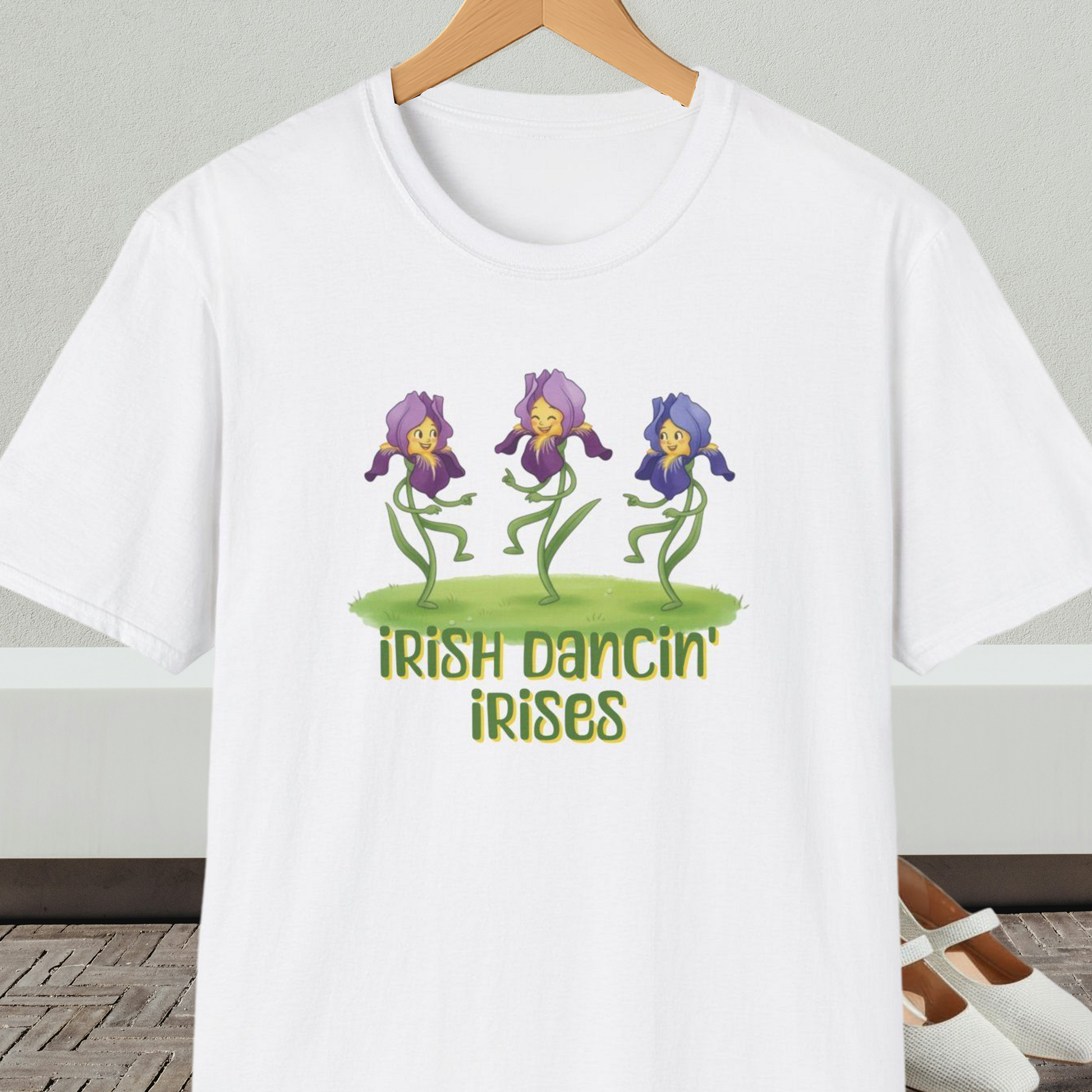 White t-shirt with 'Irish Dancin Irises' text and cartoon dancing flowers design.