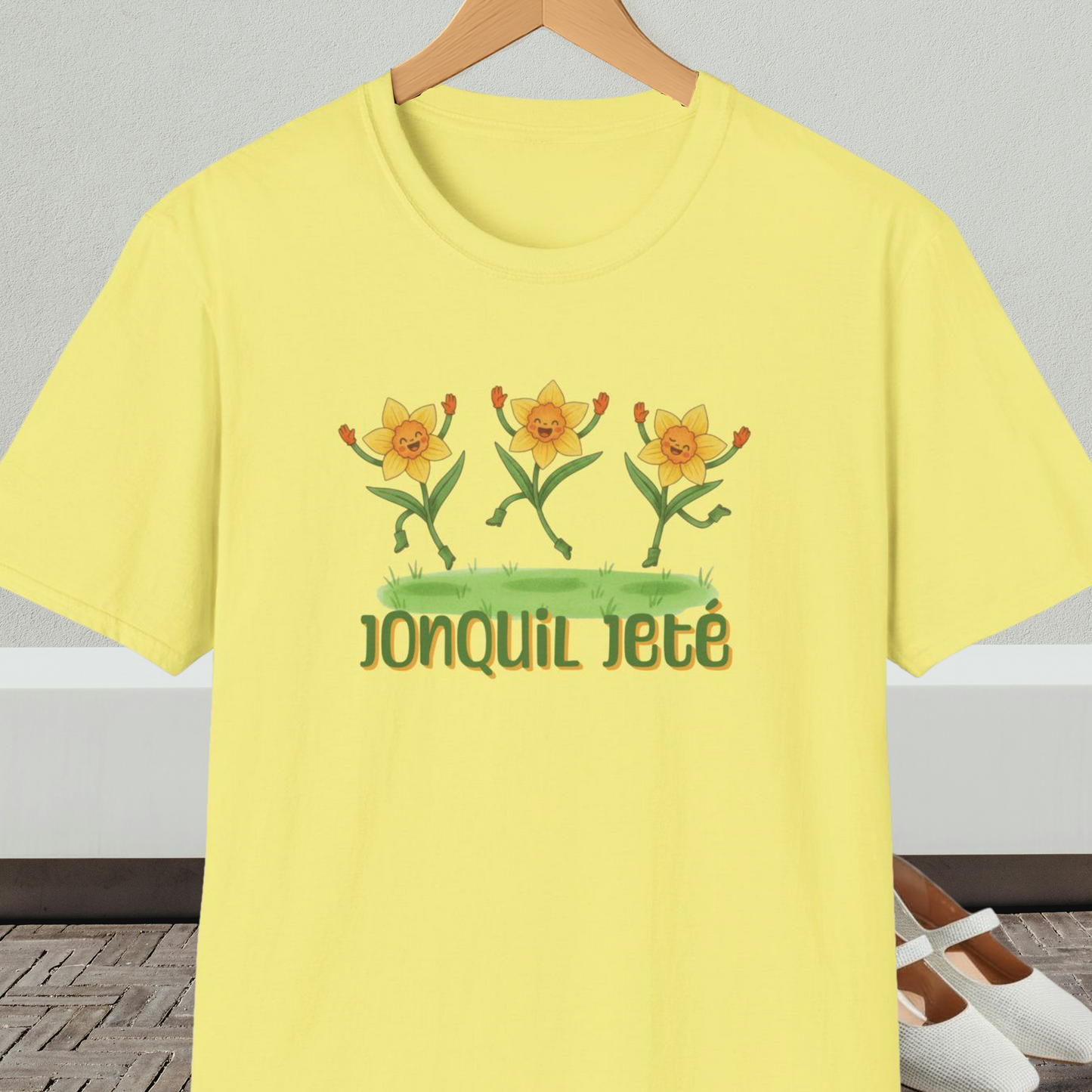 Yellow t-shirt with cartoon dancing jonquils and 'Jonquil Jeté' text.
