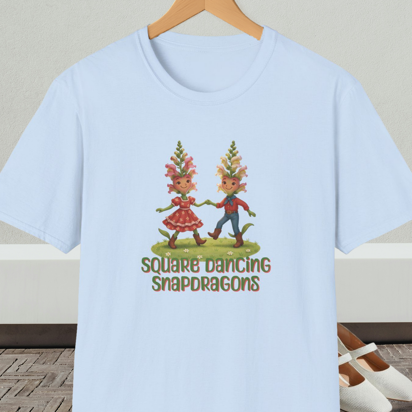 Light blue t-shirt with 'Square Dancing Snapdragons' cartoon design and text