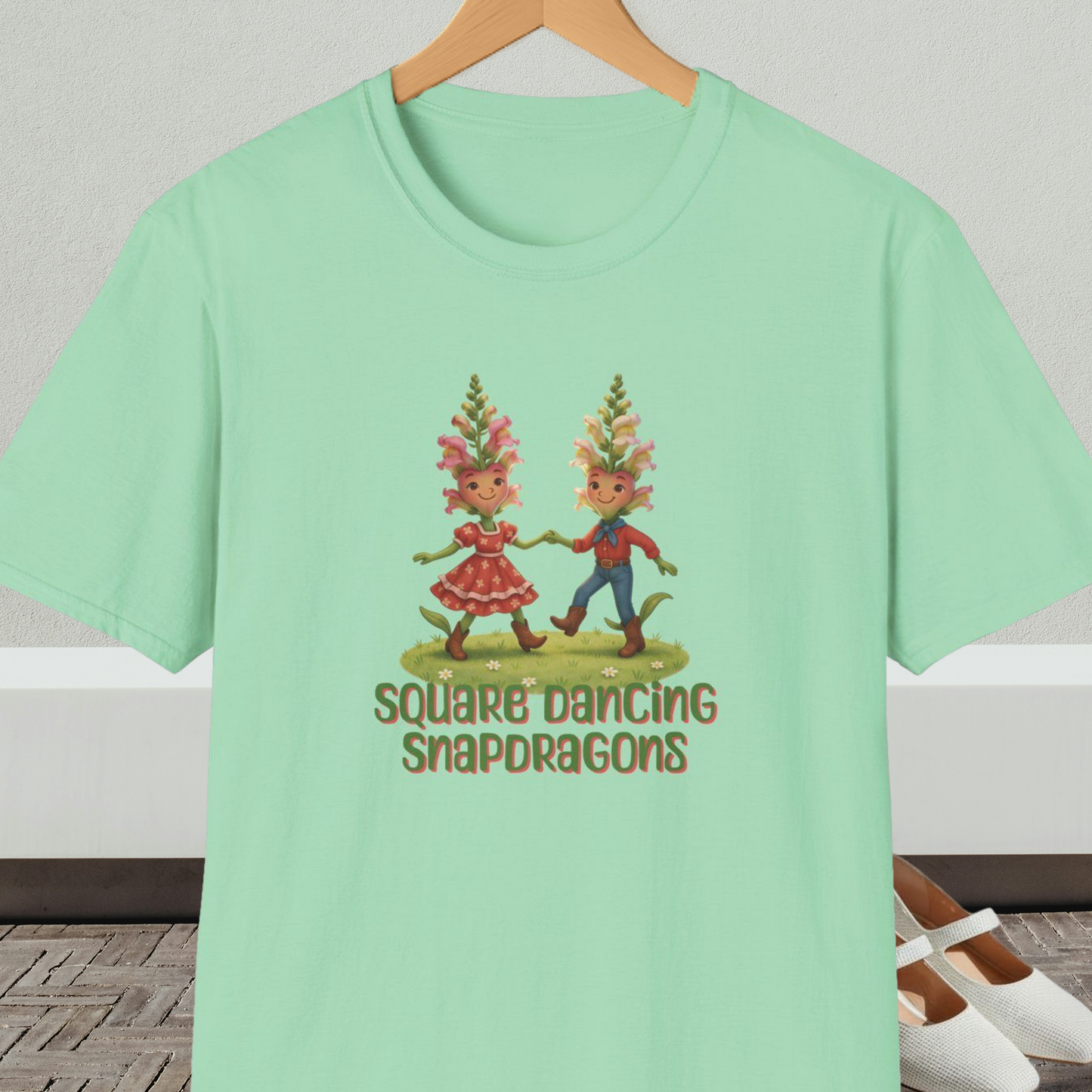 Mint green t-shirt with 'Square Dancing Snapdragons' cartoon design and text