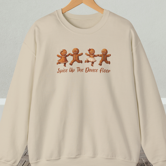 Beige sweatshirt with dancing gingerbread people design and 'Spice Up The Dance Floor' text.