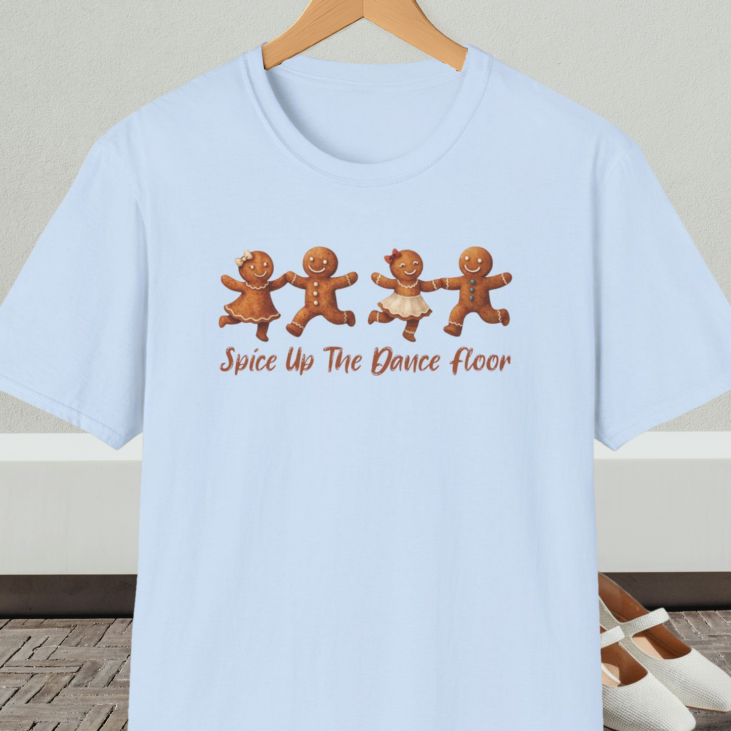 Light blue tee shirt with dancing gingerbread people, with the words 'Spice Up The Dance Floor'