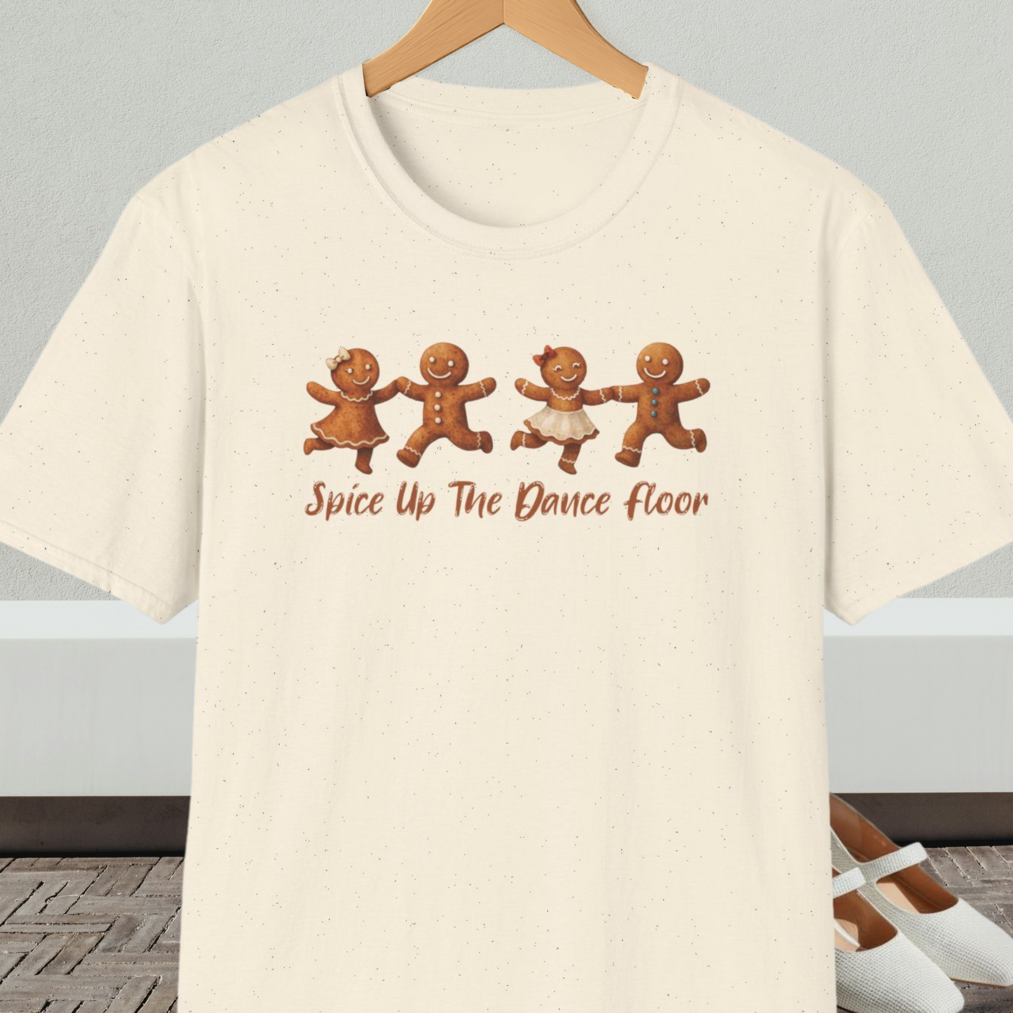 Natural beige tee shirt with dancing gingerbread people, with the words 'Spice Up The Dance Floor'