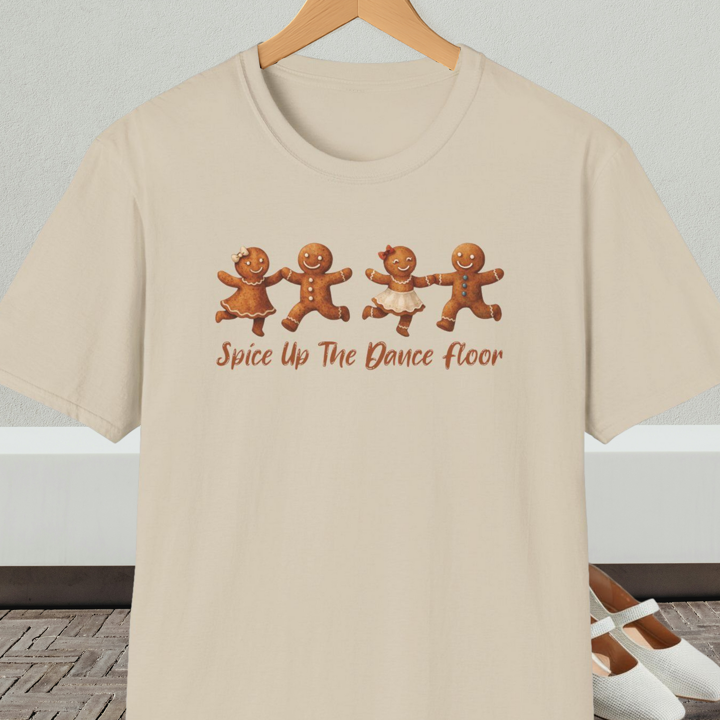 Beige tee shirt with dancing gingerbread people, with the words 'Spice Up The Dance Floor'