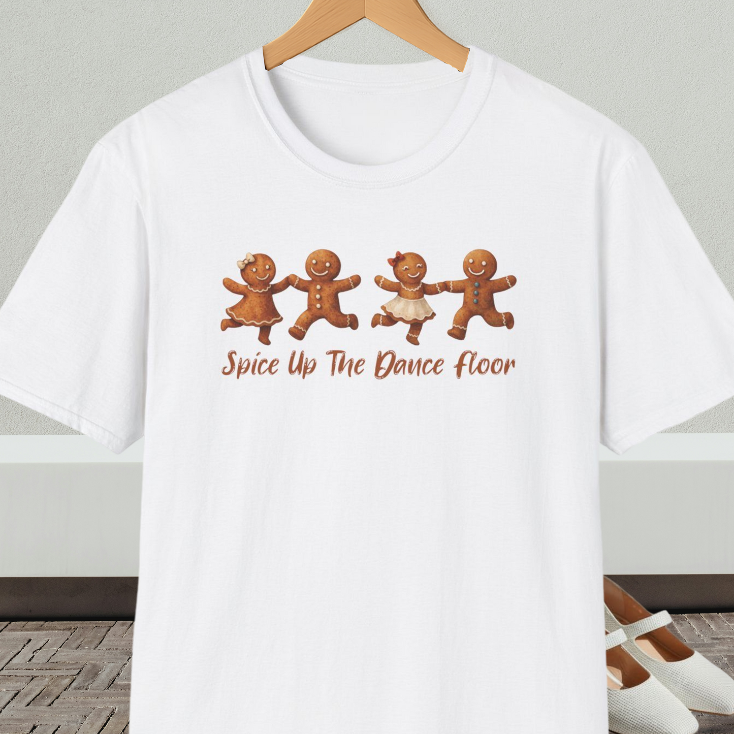 White tee shirt with dancing gingerbread people, with the words 'Spice Up The Dance Floor'