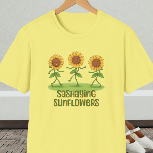 Yellow t-shirt with cartoon sunflowers and 'Sashaying Sunflowers' text, on a hanger against a neutral background.