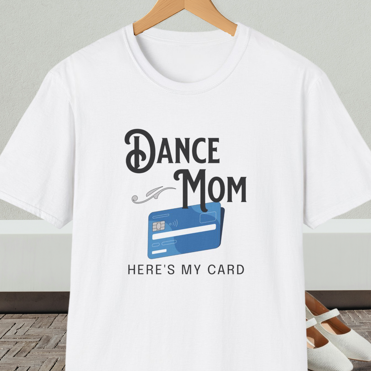 White t-shirt with 'Dance Mom, Here's My Card' text and credit card graphic, on a hanger with a neutral background.