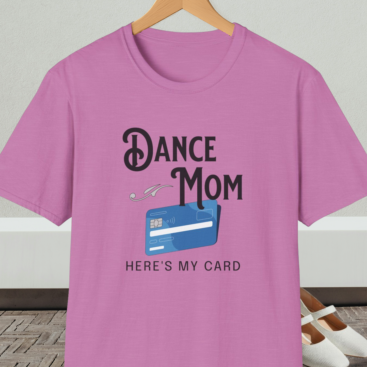Orchid t-shirt with 'Dance Mom, Here's My Card' text and credit card graphic, on a hanger with a neutral background.