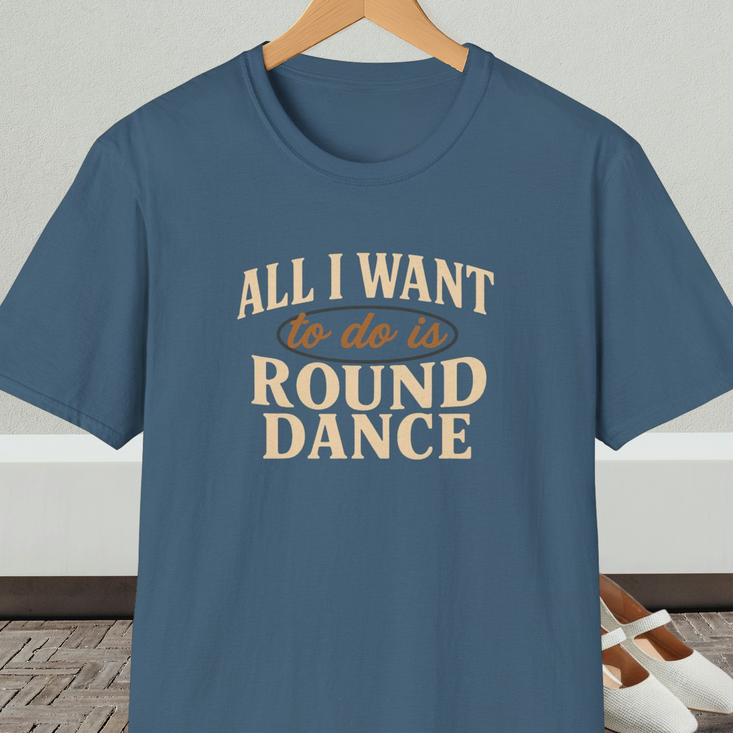 Steel blue t-shirt with text 'All I Want to do is Round Dance' on a hanger against a neutral background.