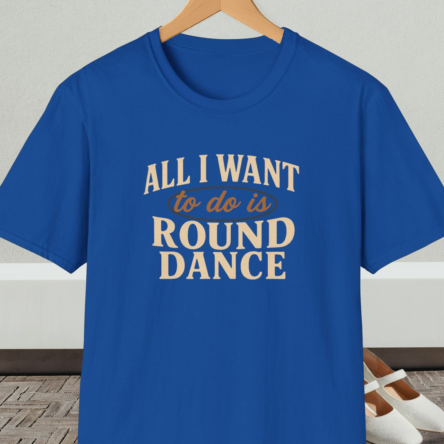 Royal blue t-shirt with text 'All I Want to do is Round Dance' on a hanger against a neutral background.